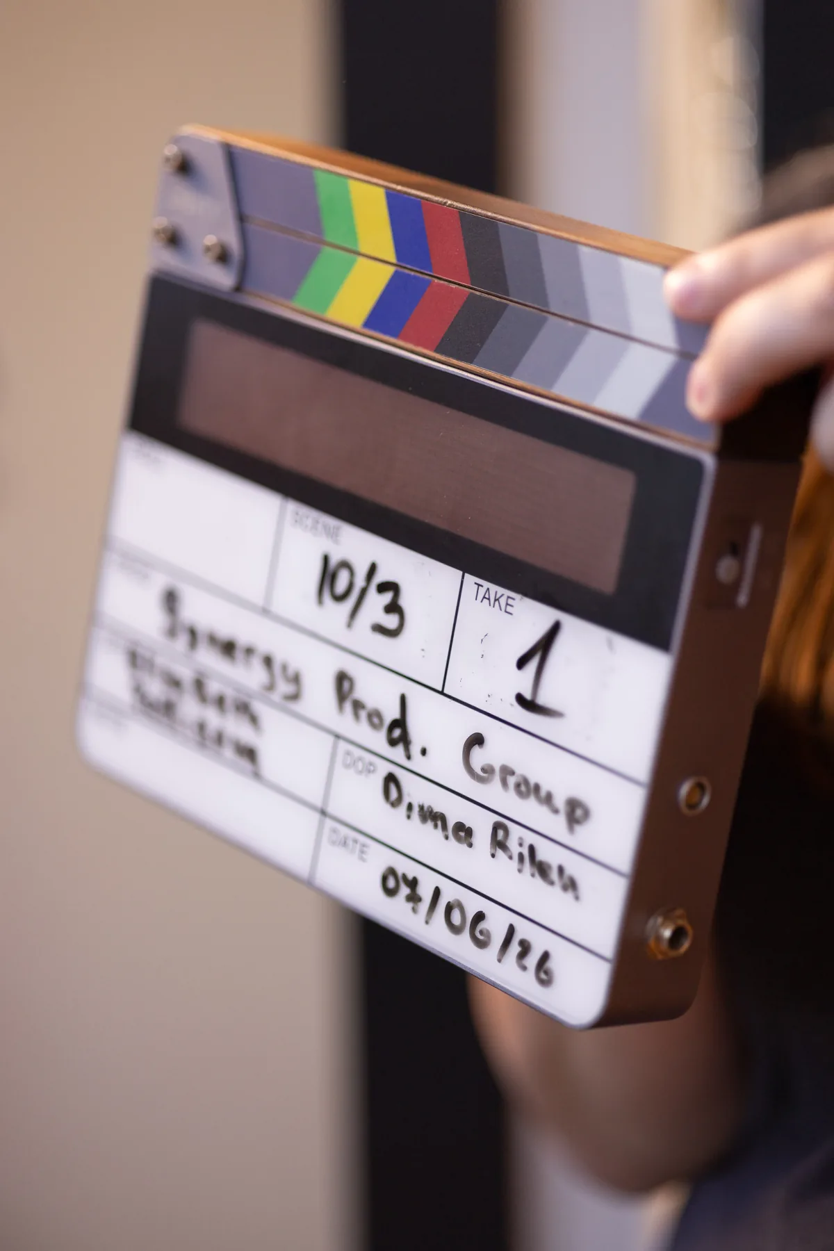 Crew member holding up a production slate